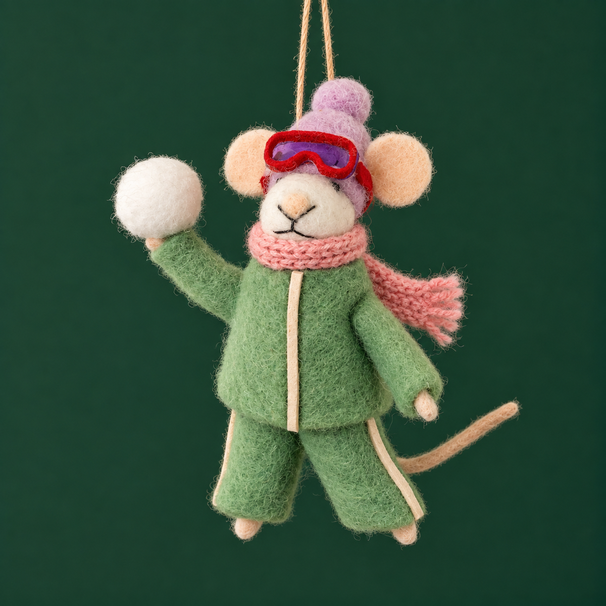 a mouse shaped ornament wearing snow gear and holding a snowball. 