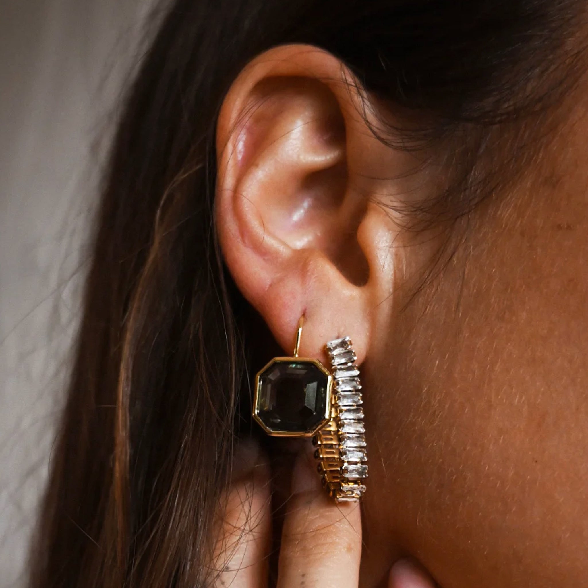 A pair of hoop earrings made of cz stones. 