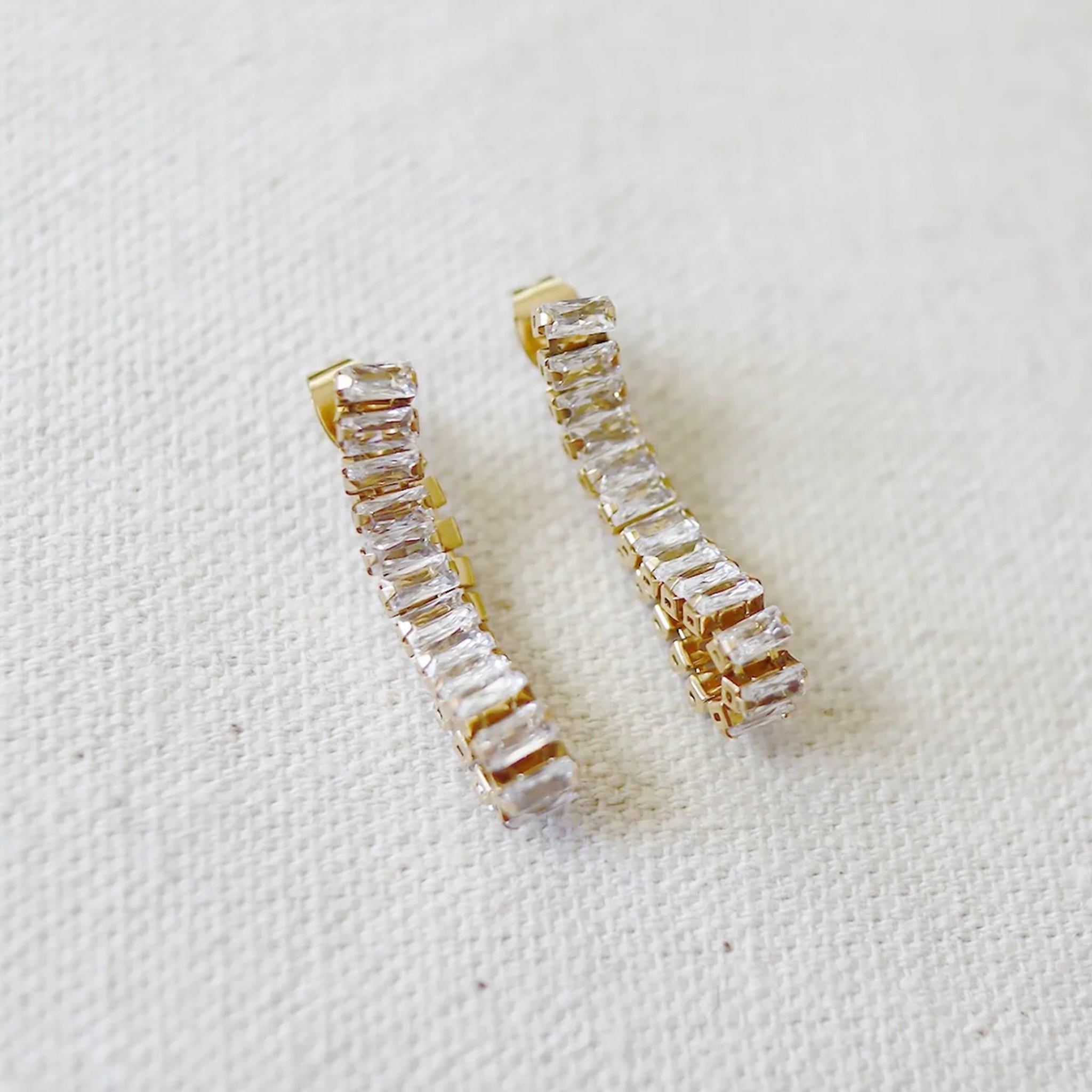 A pair of hoop earrings made of cz stones. 
