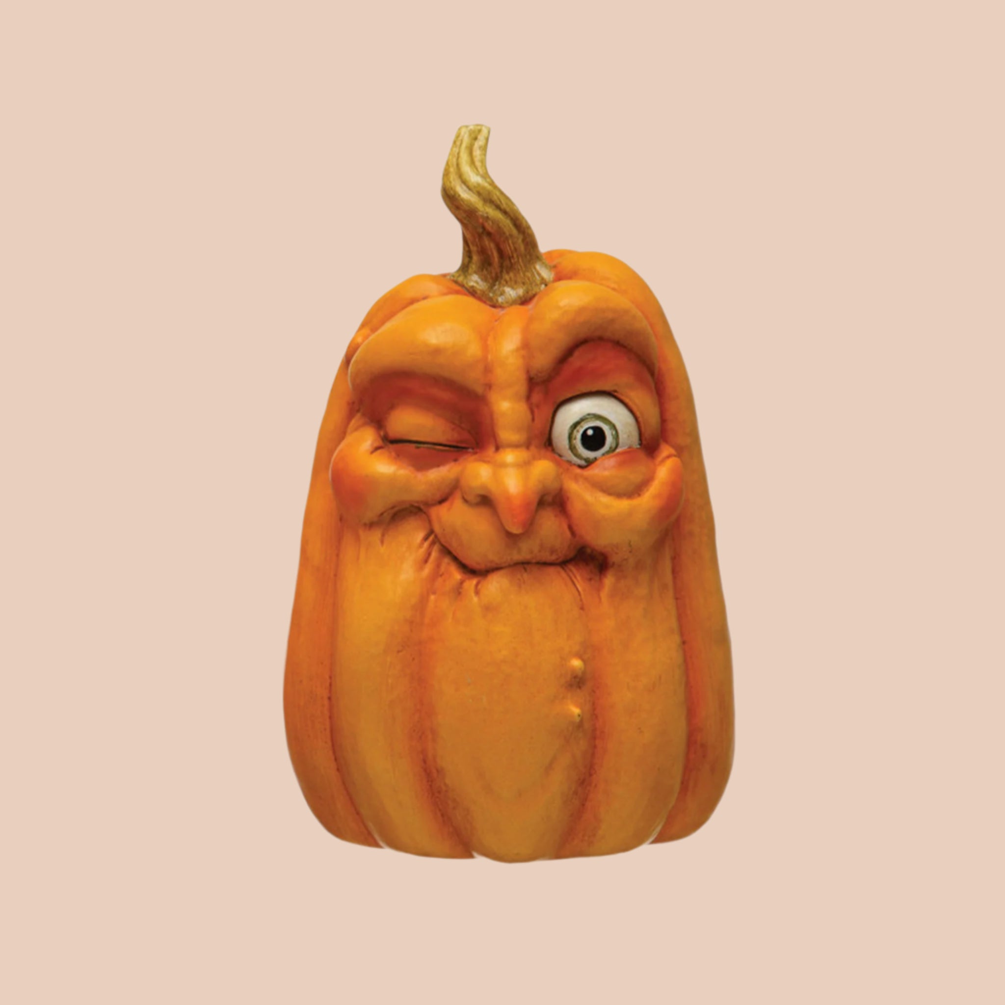 A taller shaped pumpkin decor piece with a funny face on it. 