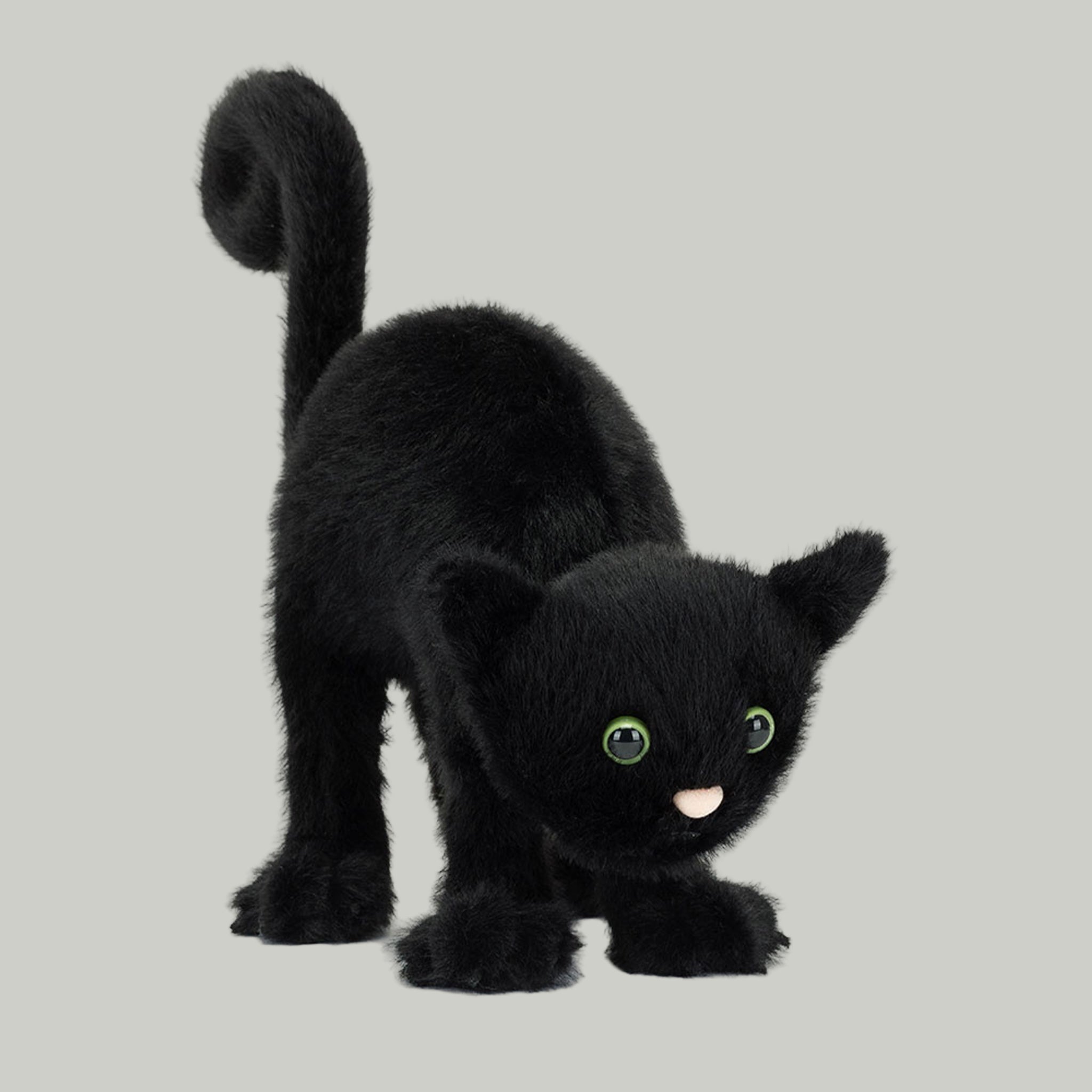 A black cat shaped stuffed animal toy with a spooky arched back. 