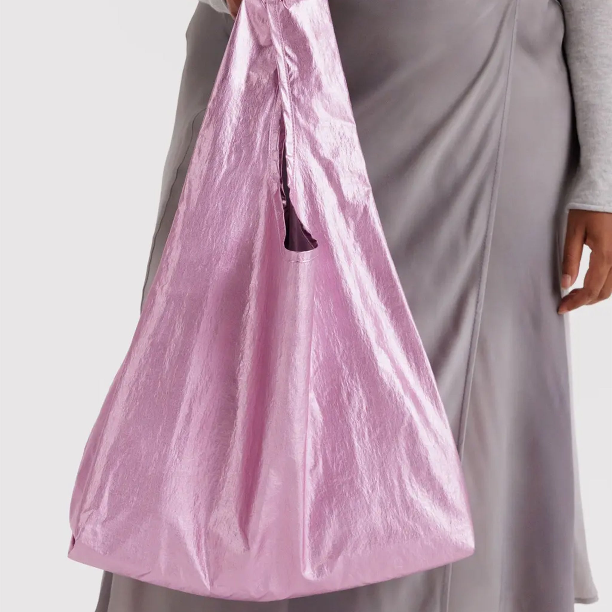 A light pink metallic nylon tote bag. 