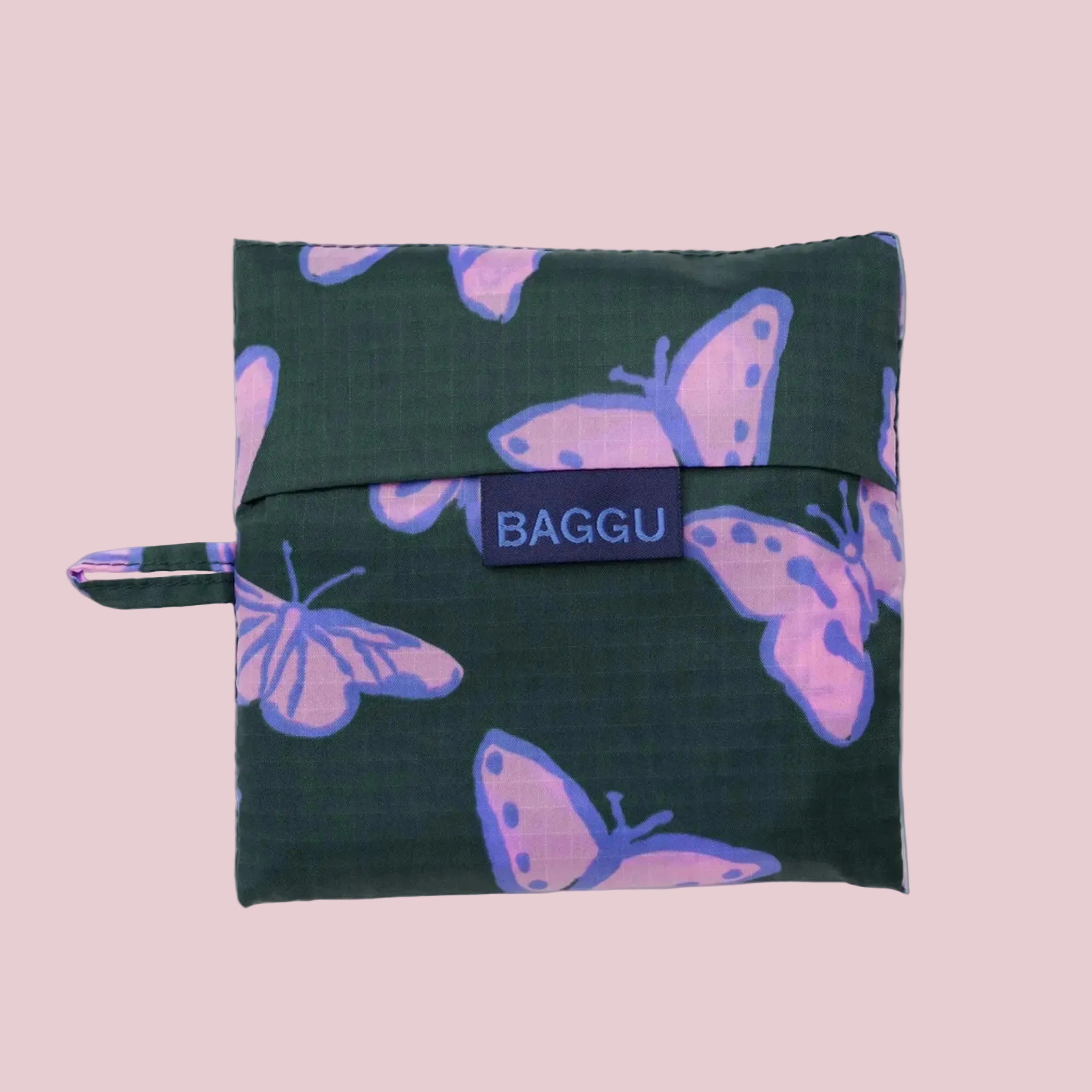 A green and purple nylon tote bag with a butterfly print. 