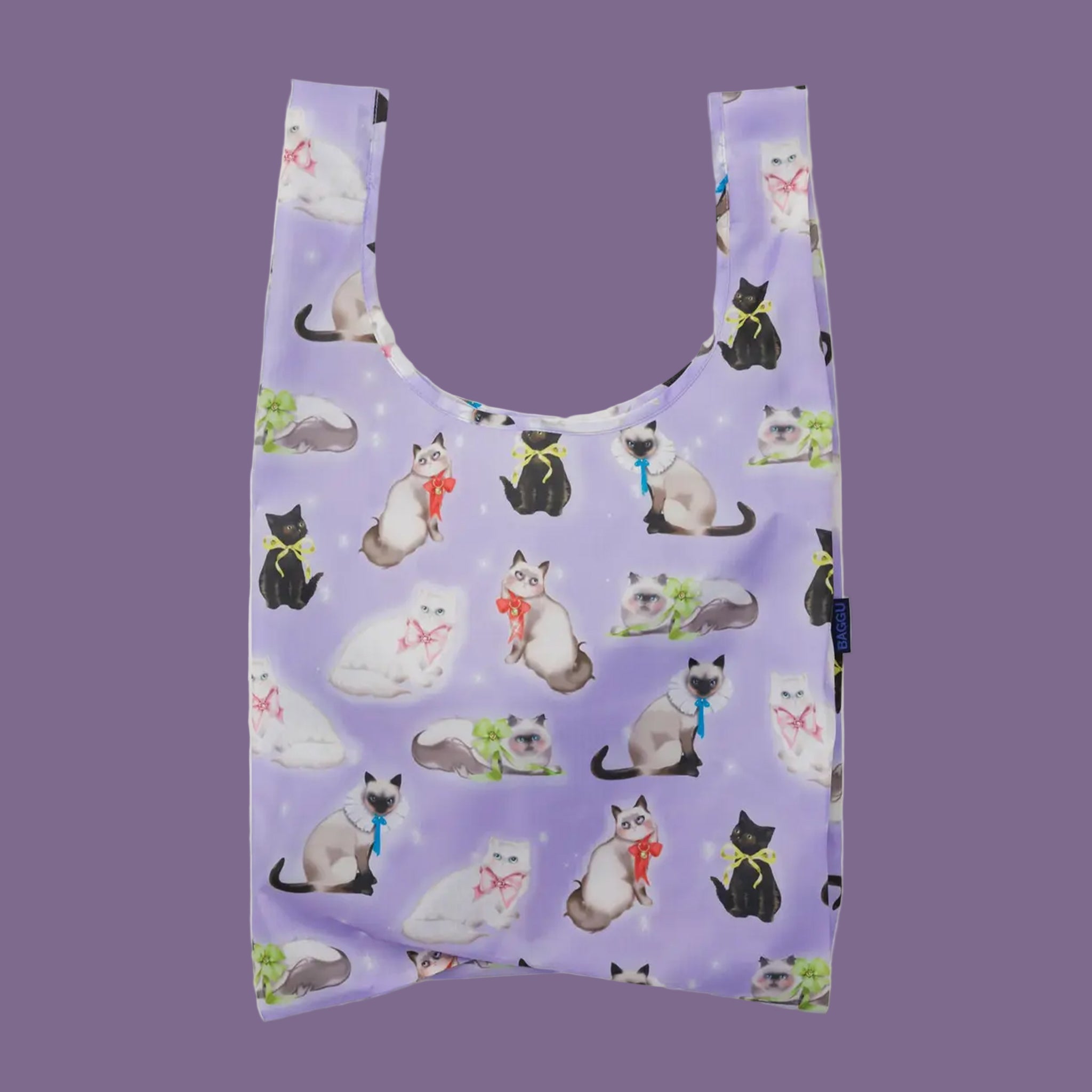 A light purple nylon tote with a cat print. 