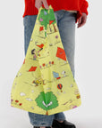 A yellow nylon reusable bag with a Charlie Brown kite eating tree print.