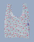 A light blue nylon bag with a cherry, flower and Miffy pattern. 