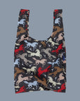 A black nylon tote bag with multi colored horse patterns. 