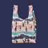 A reusable bag with pinks, teals and blues and penguin illustrations on a dark blue ground.