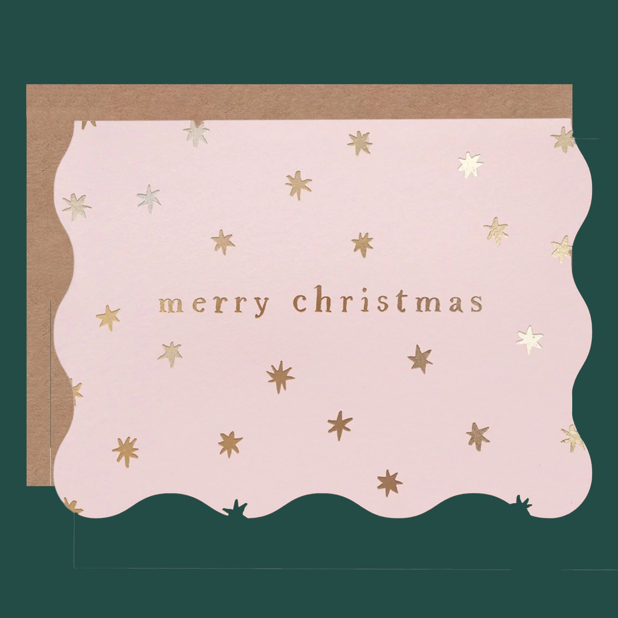 Light pink greeting card with gold metallic stars. The card reads "Merry Christmas" in gold foil.  