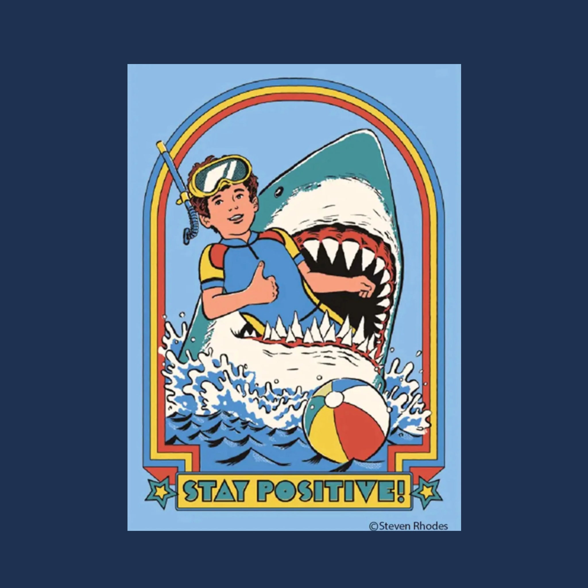 A blue rectangle magnet with an illustration of a snorkeler inside of a sharks mouth with text that reads, 'Stay Positive!'. 