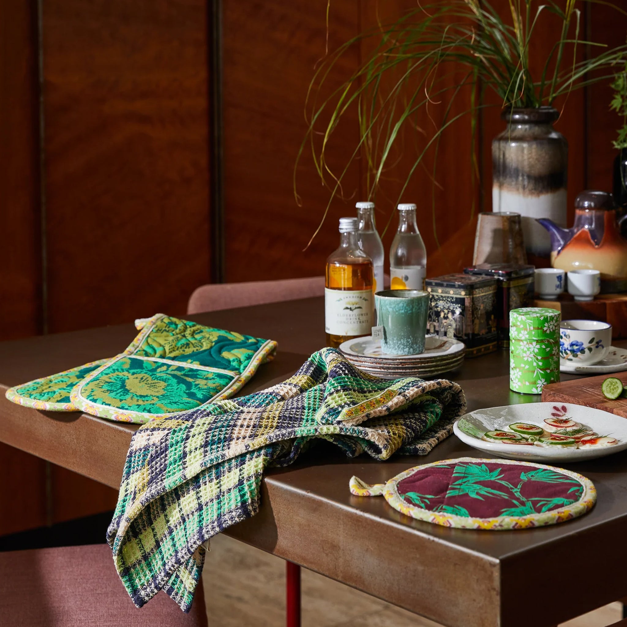 A green check waffle knit tea towel. 