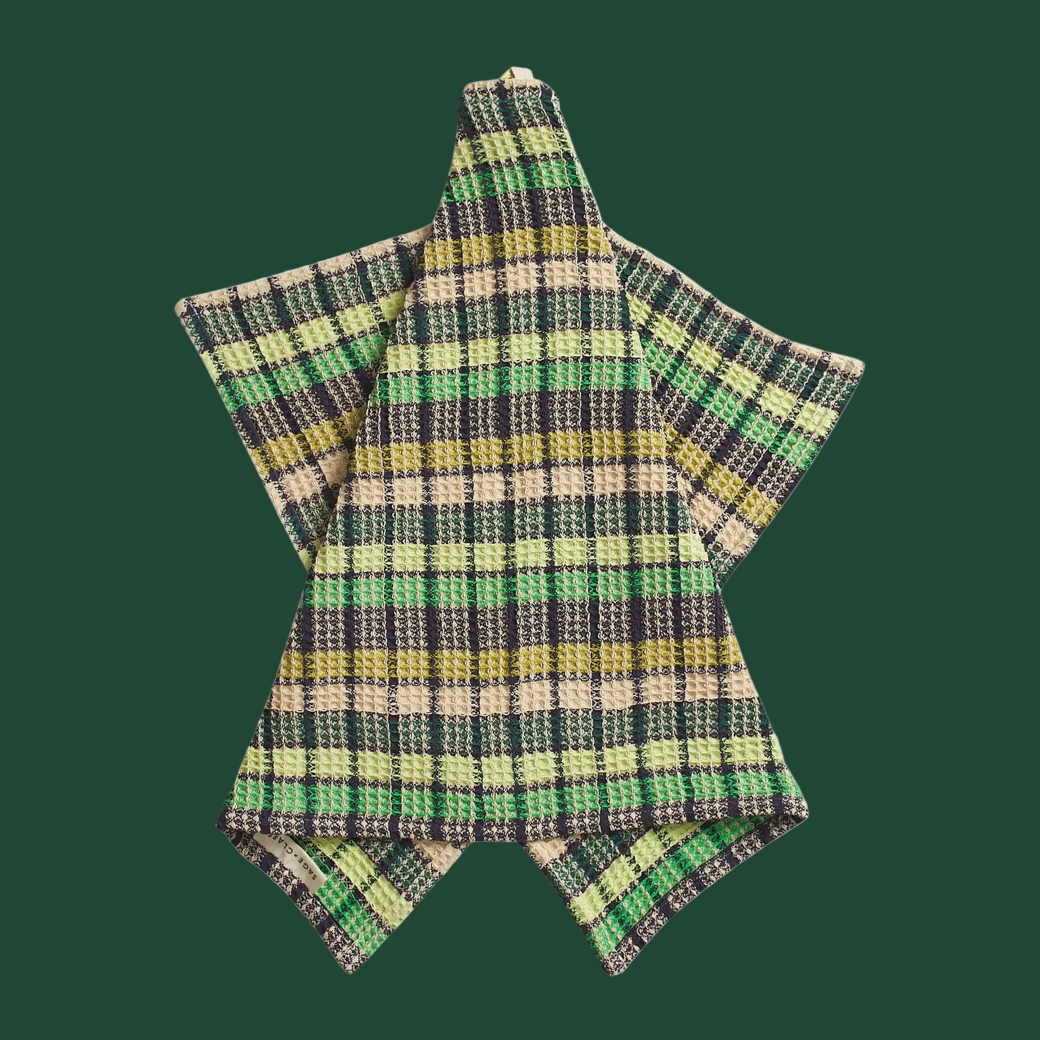 A green check waffle knit tea towel. 