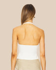 An ivory open back halter tank top.
