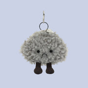 A grey storm cloud shaped bag charm with silver details. 
