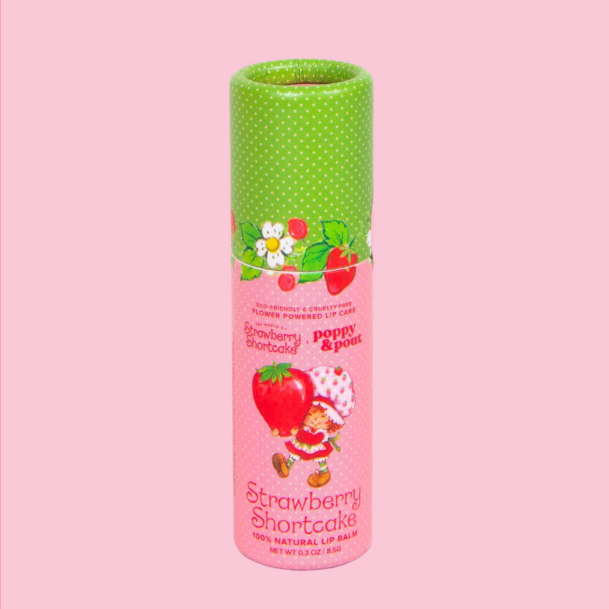 A pink and green tube of lip balm with text that reads, 'Strawberry Shortcake'. 