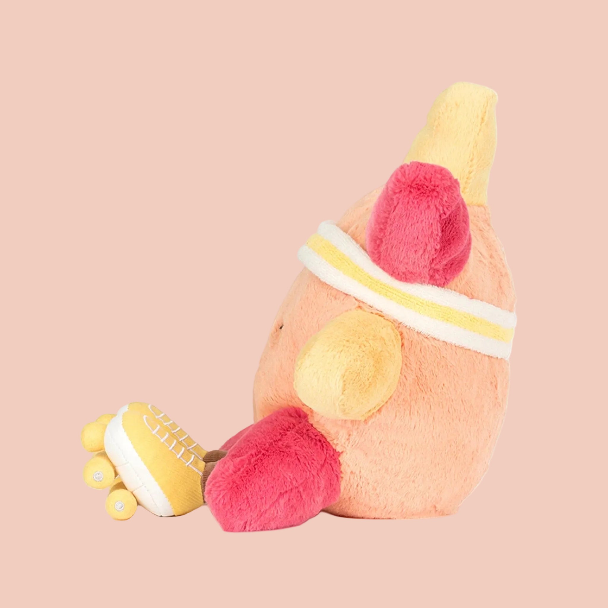 Plush toy with a sun-shaped body, pink and yellow accents 