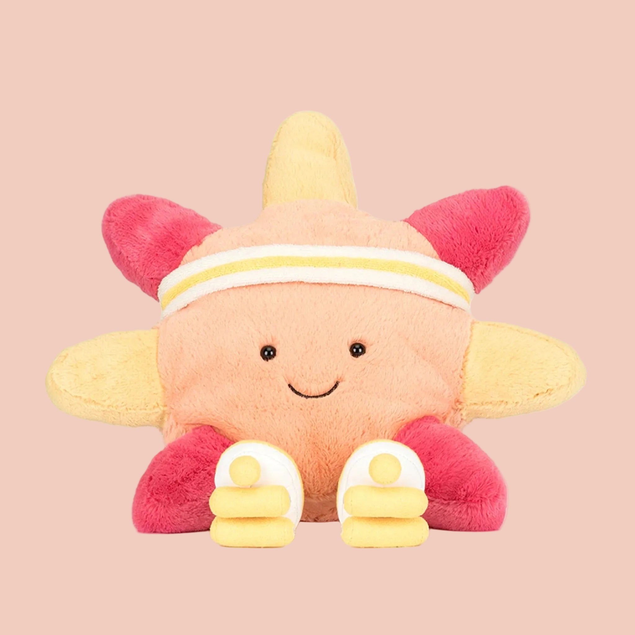 Plush toy with a sun-shaped body, pink and yellow accents 