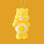 A yellow care bear shaped ornament with a yellow and orange smiling sun graphic on its stomach. 