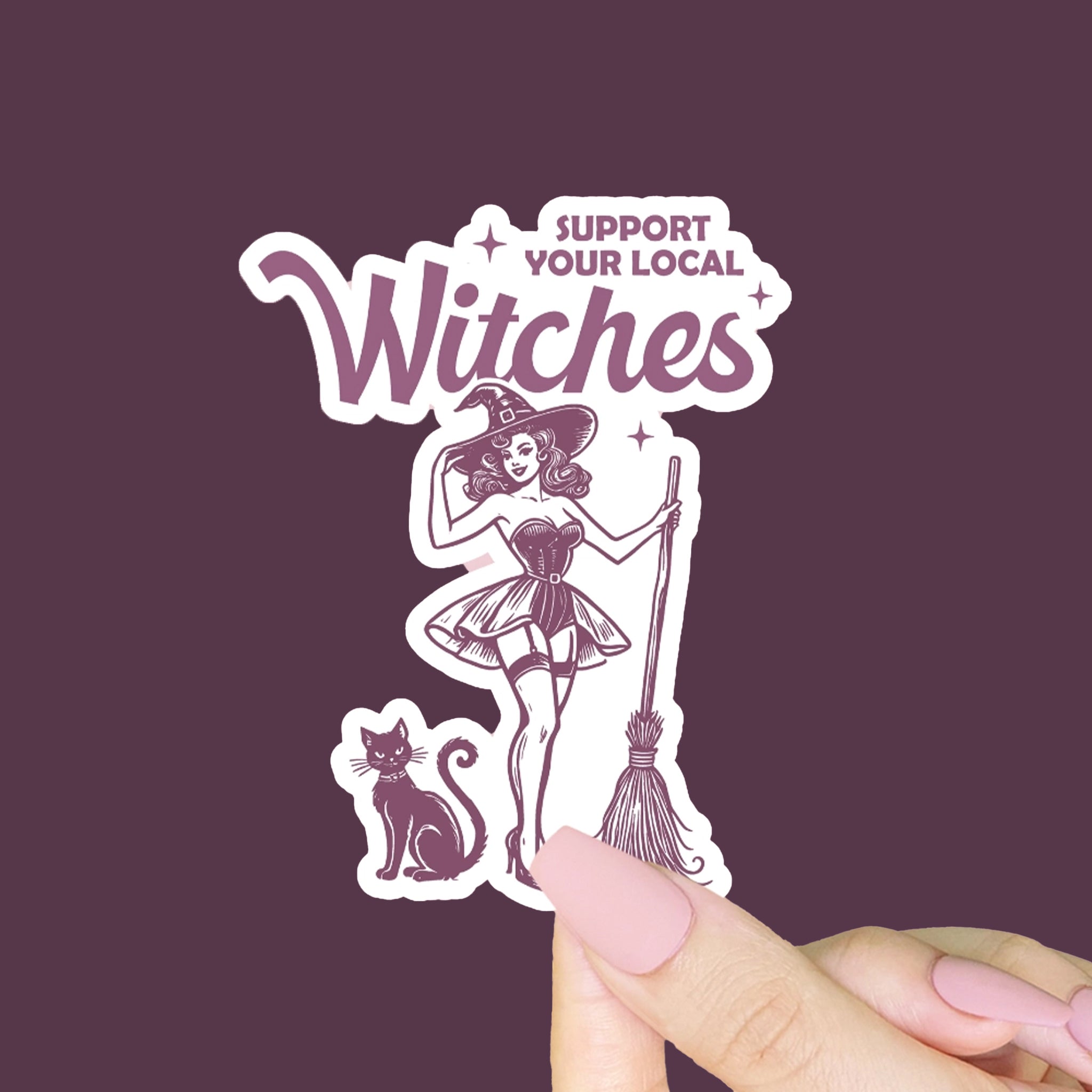 A white and purple sticker of a witch and a black cat with text that reads, 'Support your Local Witches'. 