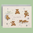 A white card with a teddy bear print with moon and star details and text in the center that reads, 'Sweet Little One'. 
