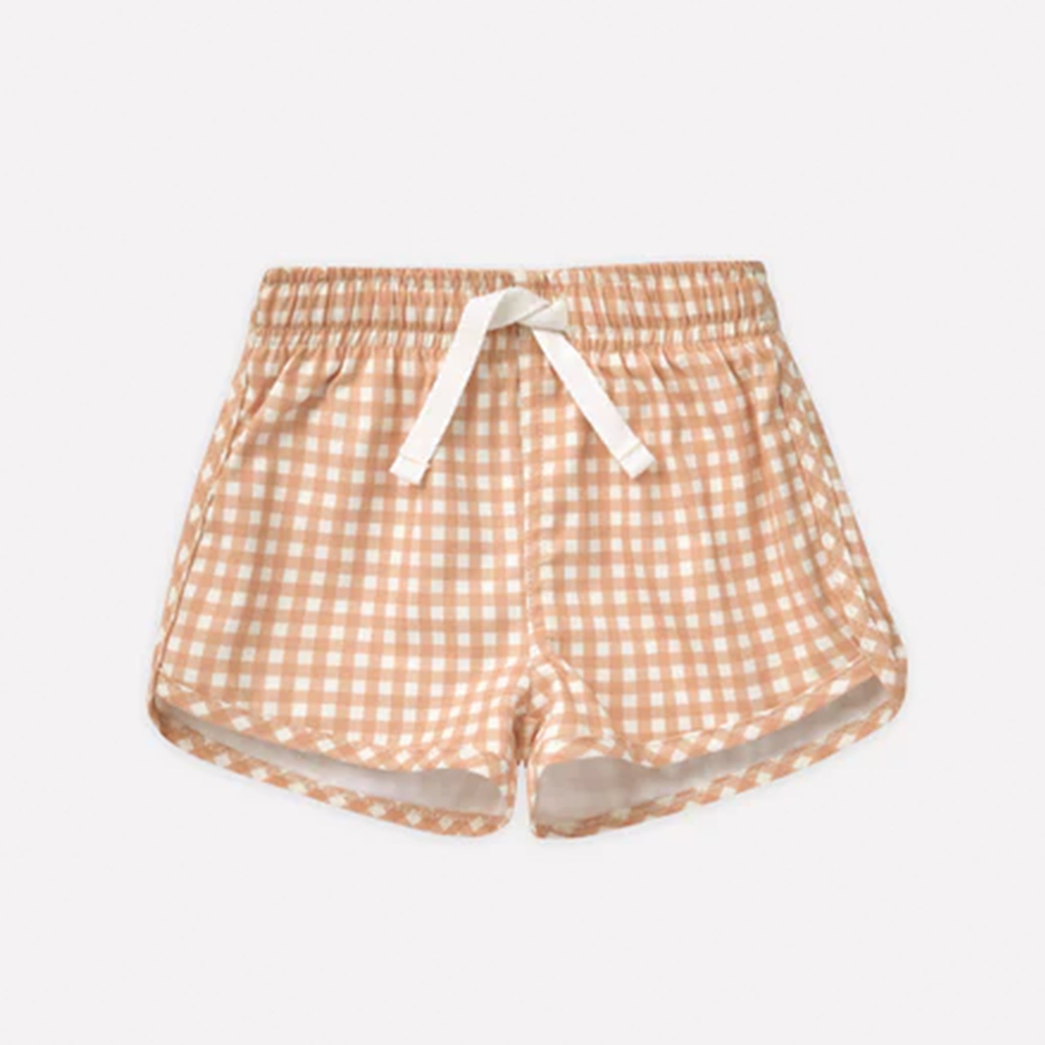 On a white background is a pair of white and light orange gingham printed swim trunks with a white drawstring. 
