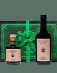 Two glass bottles of olive oil and balsamic with a mint green gift box. 