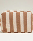 A white and tan striped terry pouch with a zipper closure. 