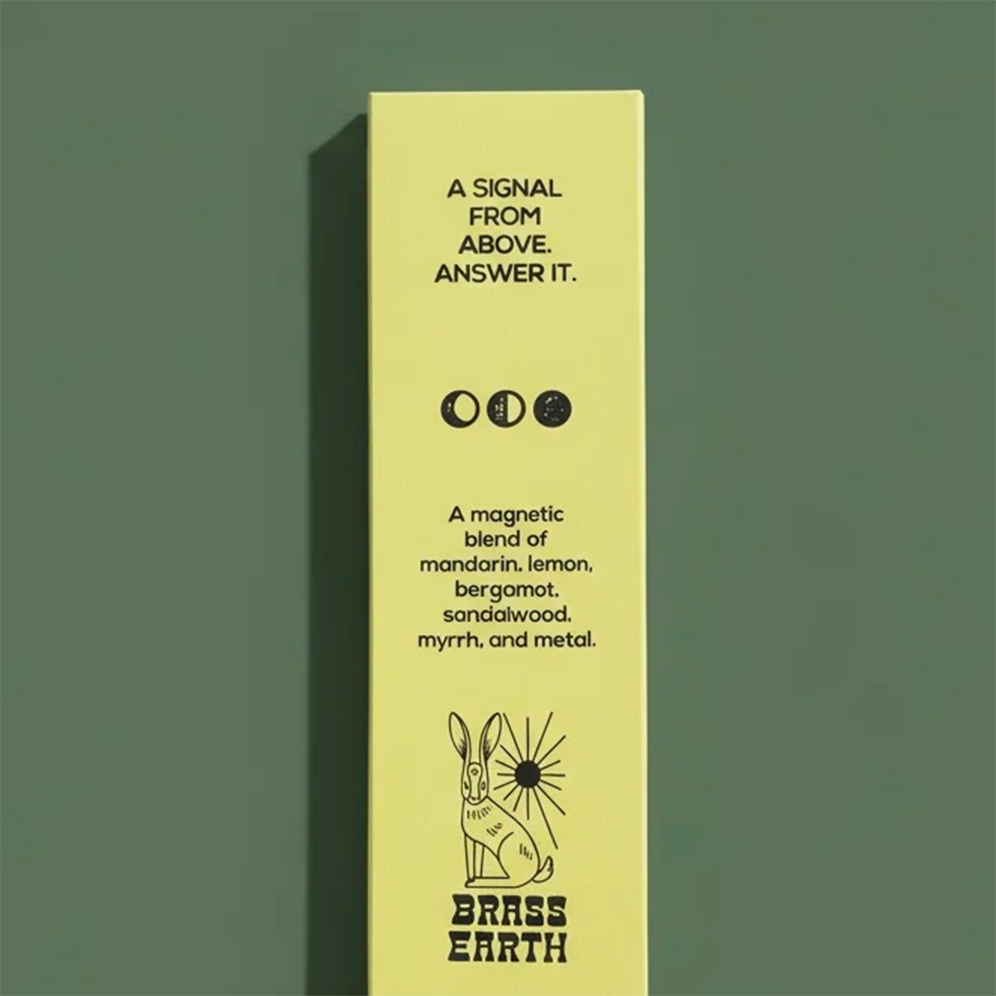 Yellow product packaging with black text and graphics on a green background