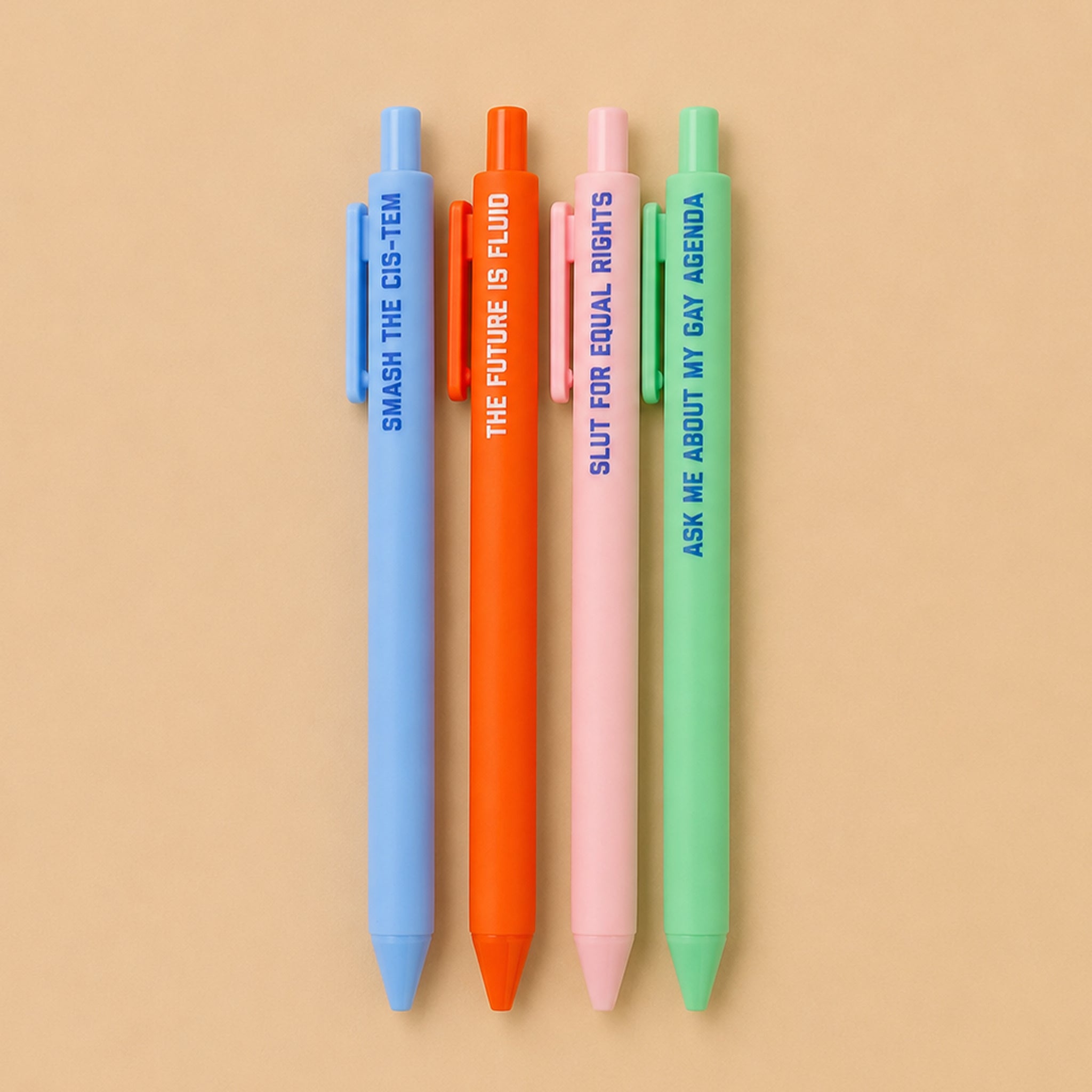 Four colorful pens with text on a beige background