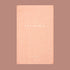 This hardcover journal is titled 'The Well Journal' pressed in gold foil print. The cover itself is a high quality texture covered in warm toned, pink bookcloth. 