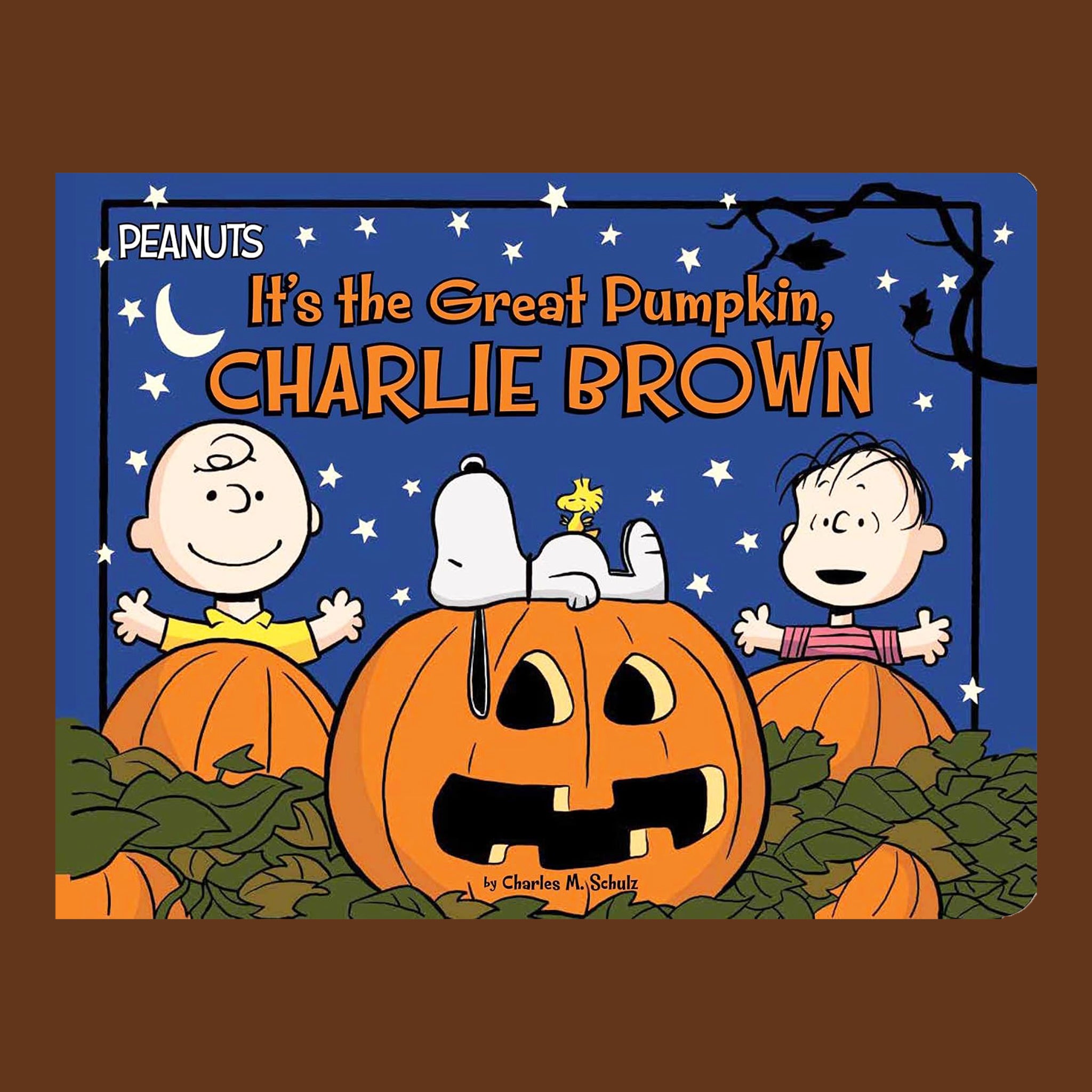 Peanuts book cover for 'It's the Great Pumpkin, Charlie Brown' featuring Charlie Brown, Snoopy, and Woodstock around a jack-o'-lantern on a blue night sky background, centered on a brown square.
