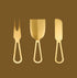 A set of gold cheese knives. 