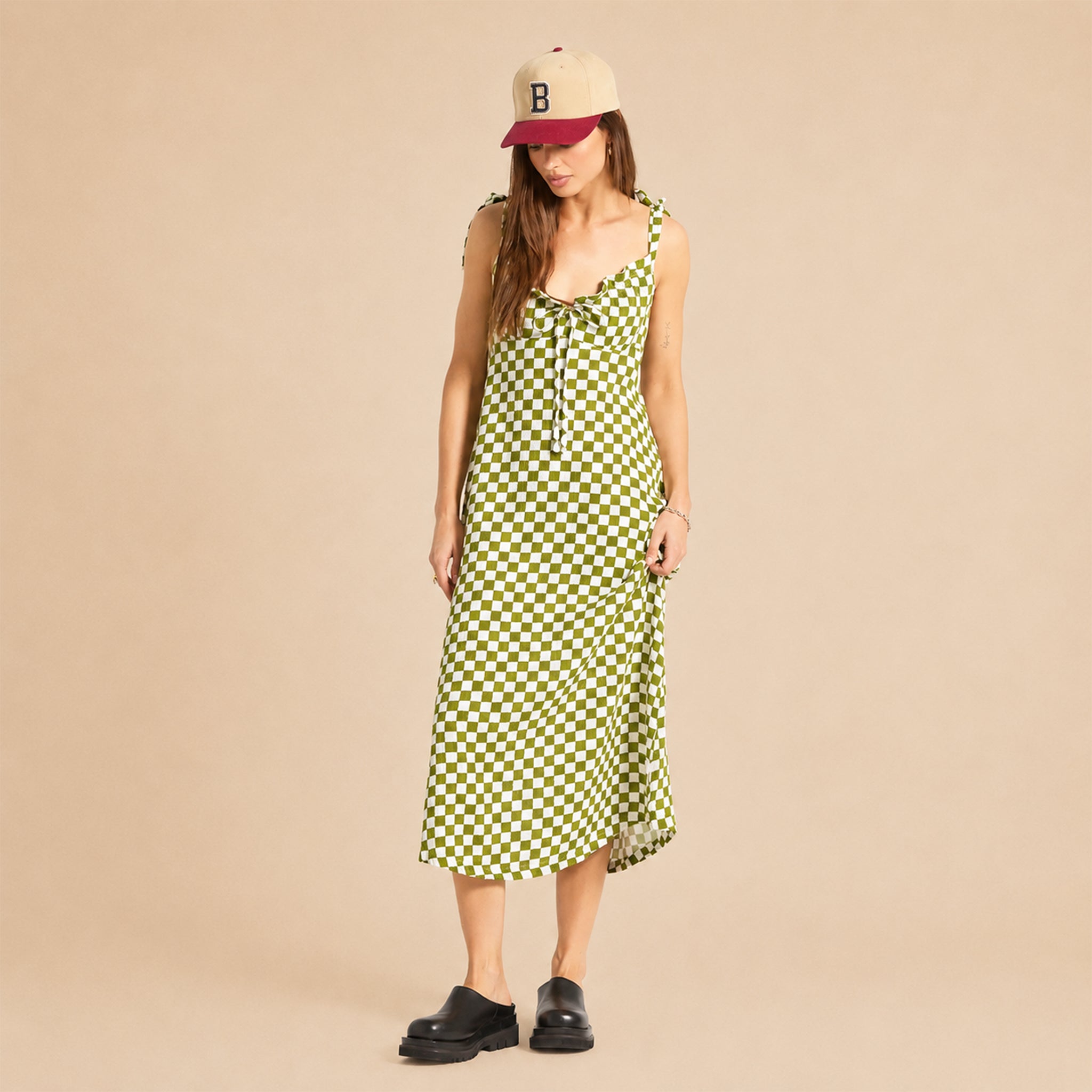 A green and cream checkered tie dress. 