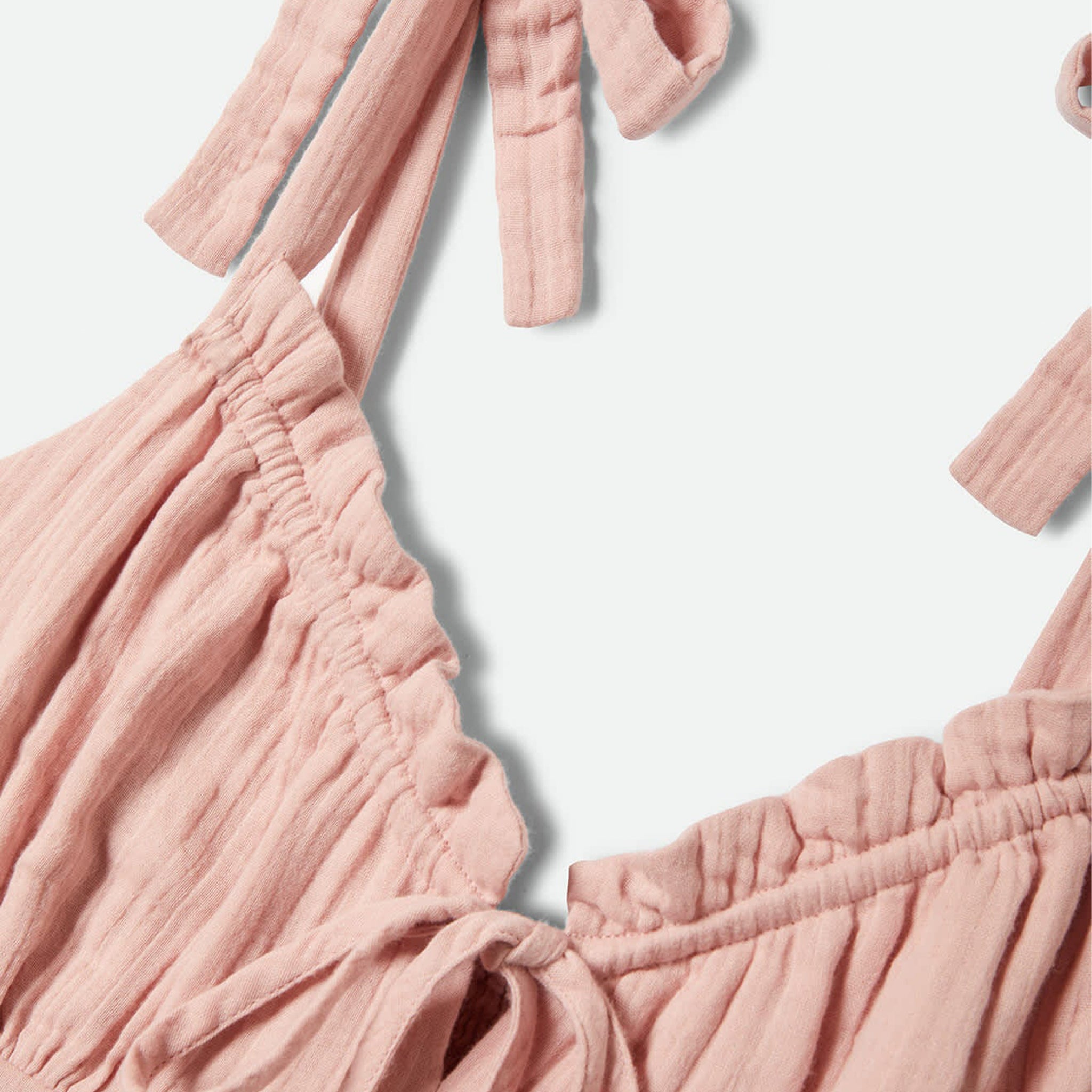 Pink dress against a beige background
