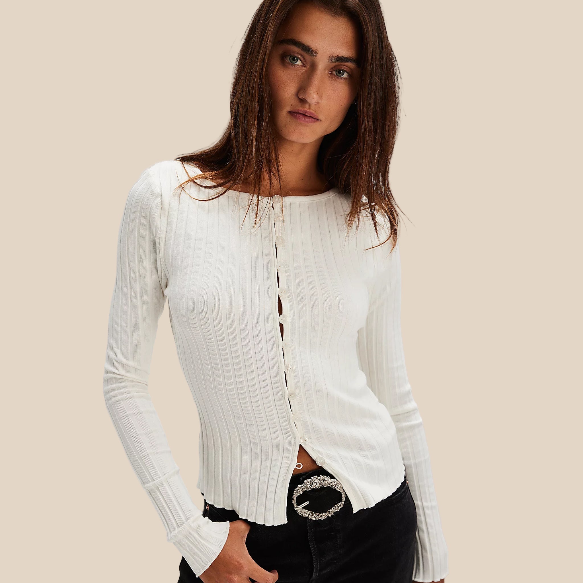 A white ribbed shirt with a button closure. 