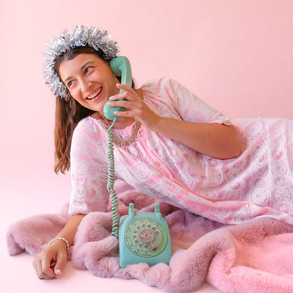 A silver tinsel headband. 