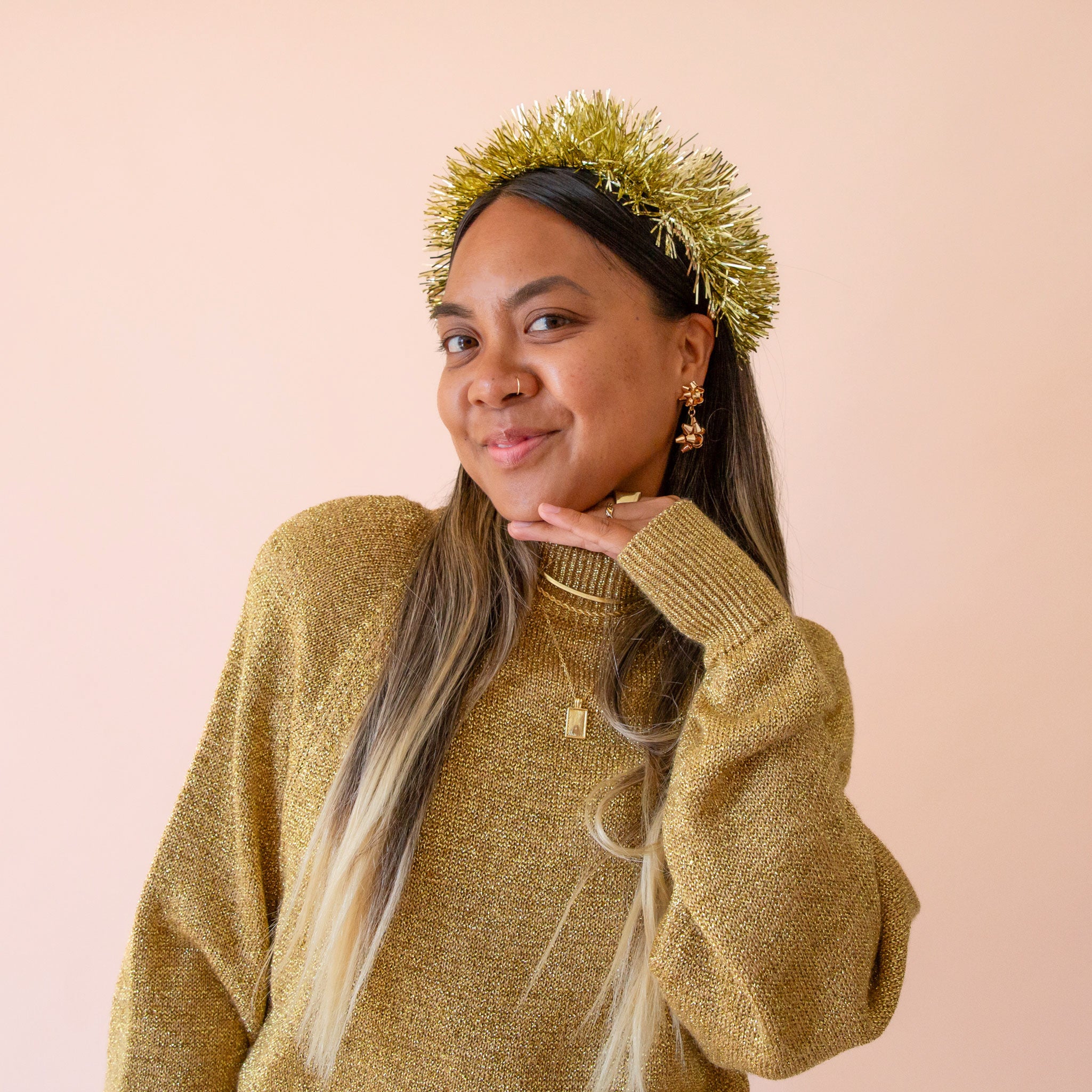 A gold tinsel headband. 