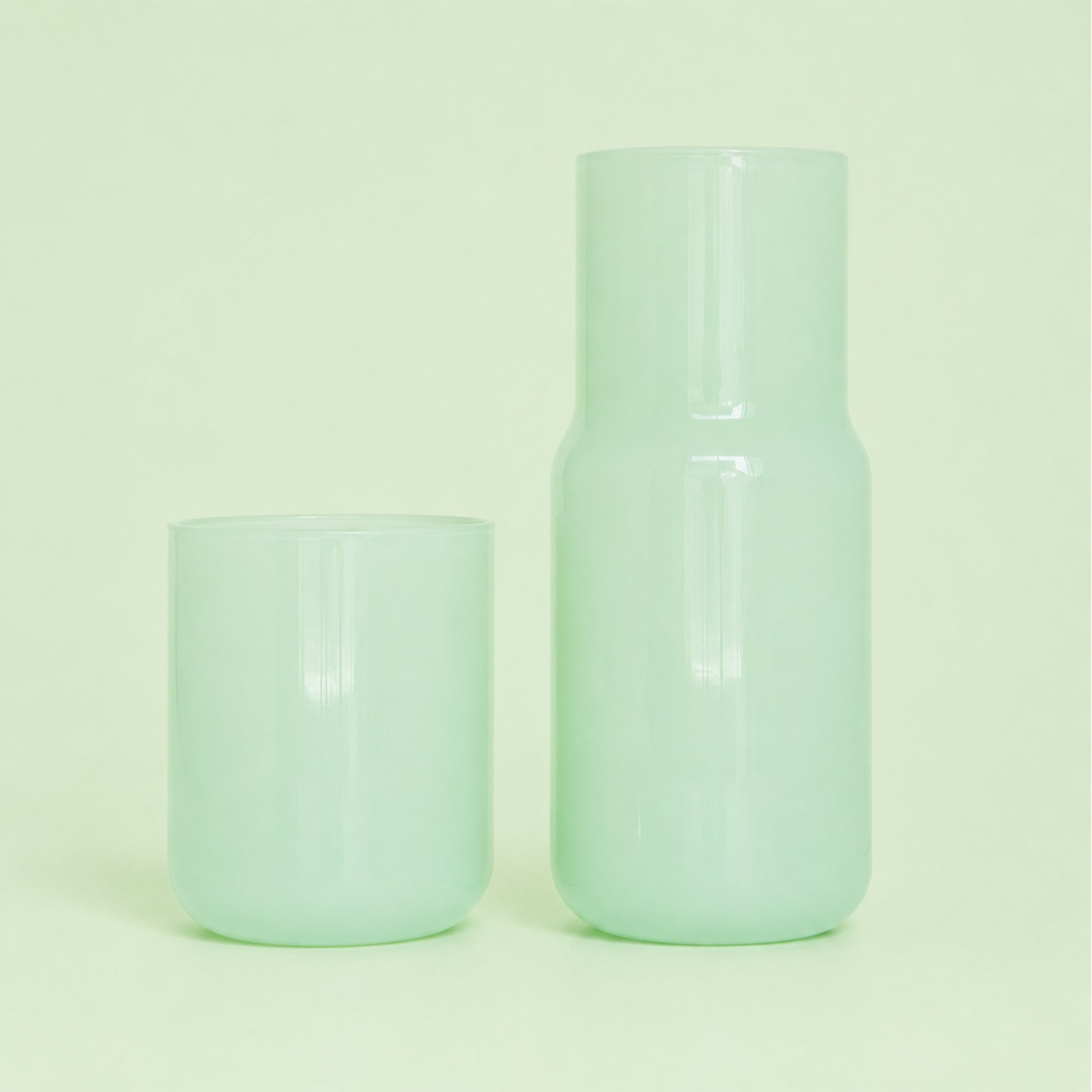 A light green glass carafe. 