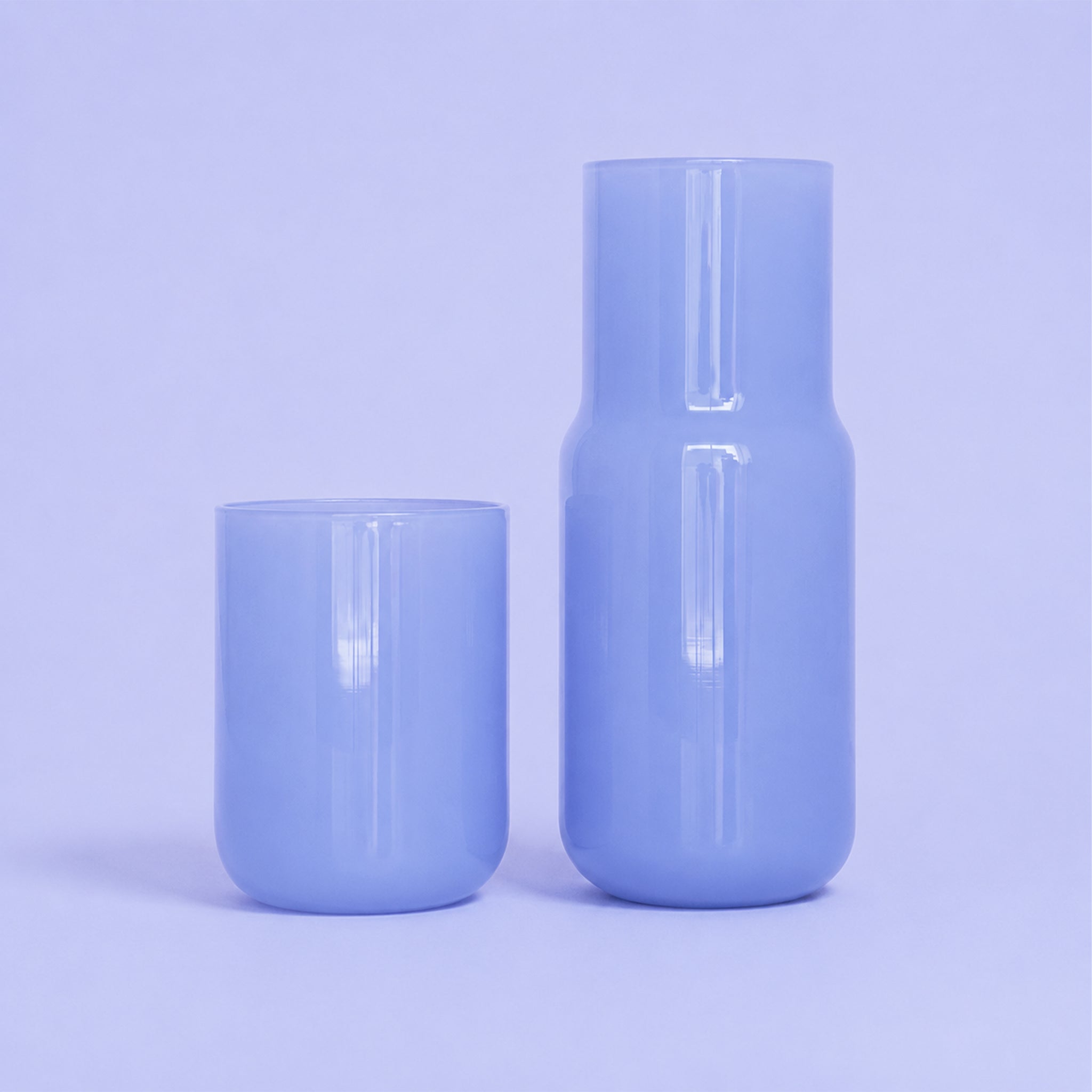 A periwinkle glass carafe. 
