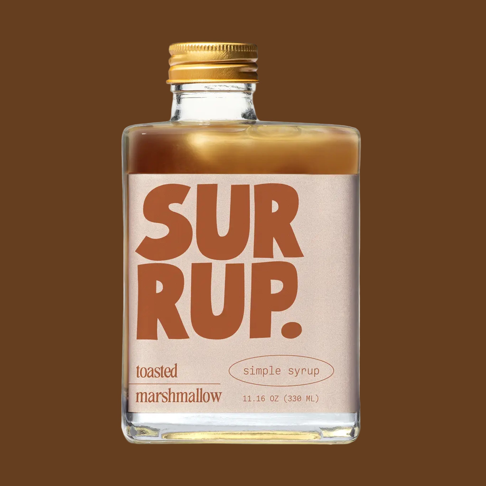 A glass rectangle bottle of syrup with a label that reads, "Surrup. toasted marshmallow simple syrup". 