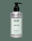 A silver bottle of dish soap with a light blue label that reads, 'Flamingo Estate Dish Soap'. 