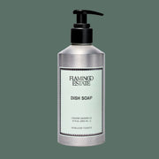 A silver bottle of dish soap with a light blue label that reads, 'Flamingo Estate Dish Soap'. 