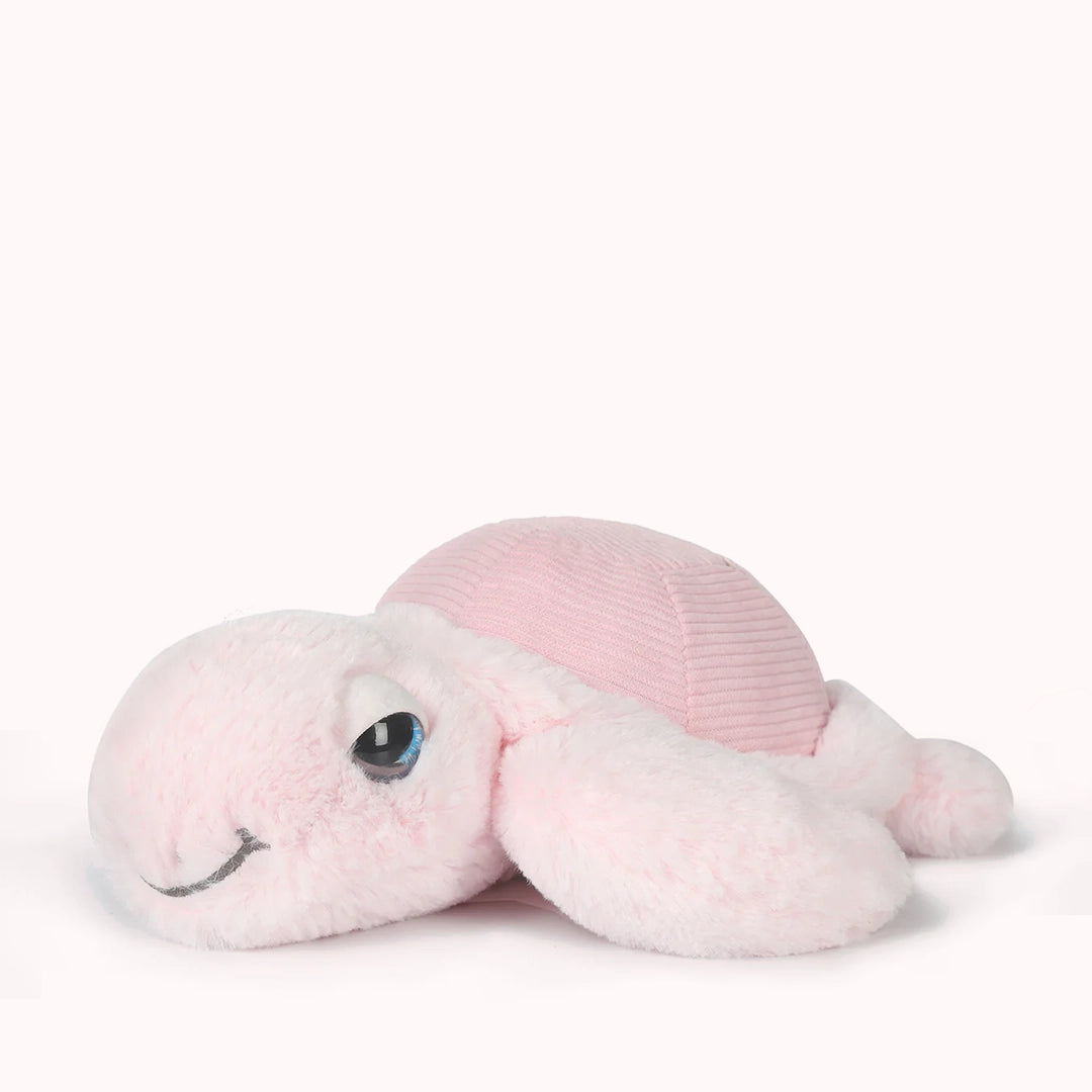 On a white background is a pink turtle stuffed animal. 