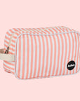 A coral and ivory striped cosmetic bag. 