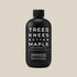 A black bottle of syrup with text on the front that reads, 'Tree Knees Butter Maple'. 