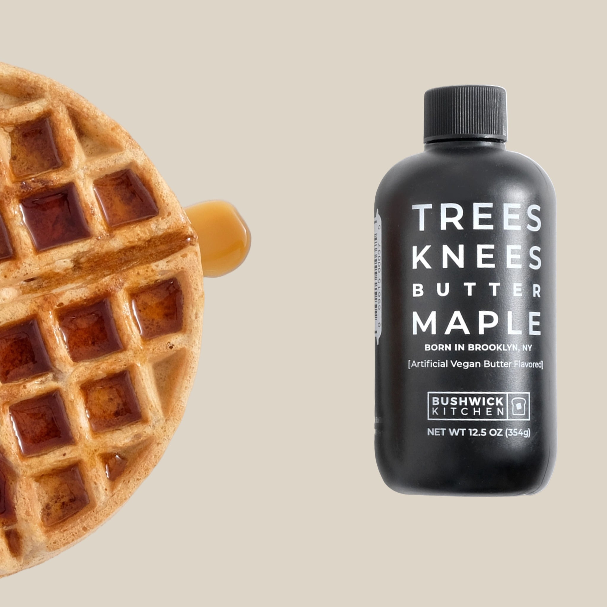 A black bottle of syrup with text on the front that reads, 'Tree Knees Butter Maple'. 