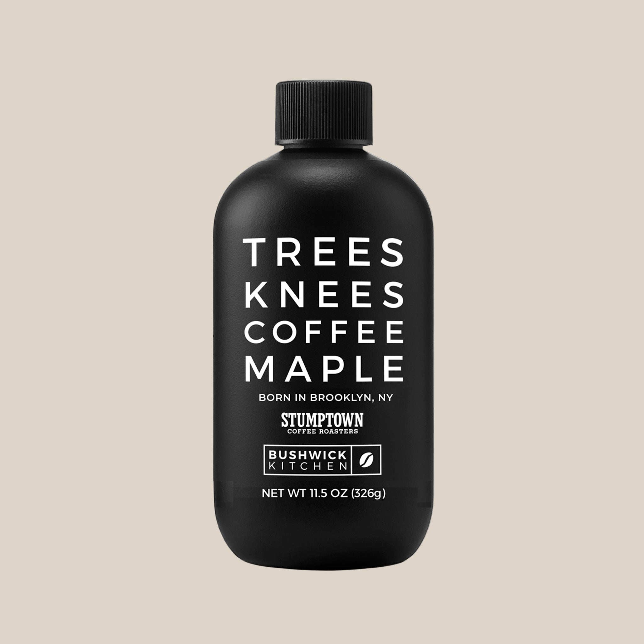 A black bottle of coffee flavored maple syrup with white text that reads, 'Trees Knees Coffee Maple'.