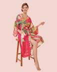 A hot pink robe with a floral pattern. 