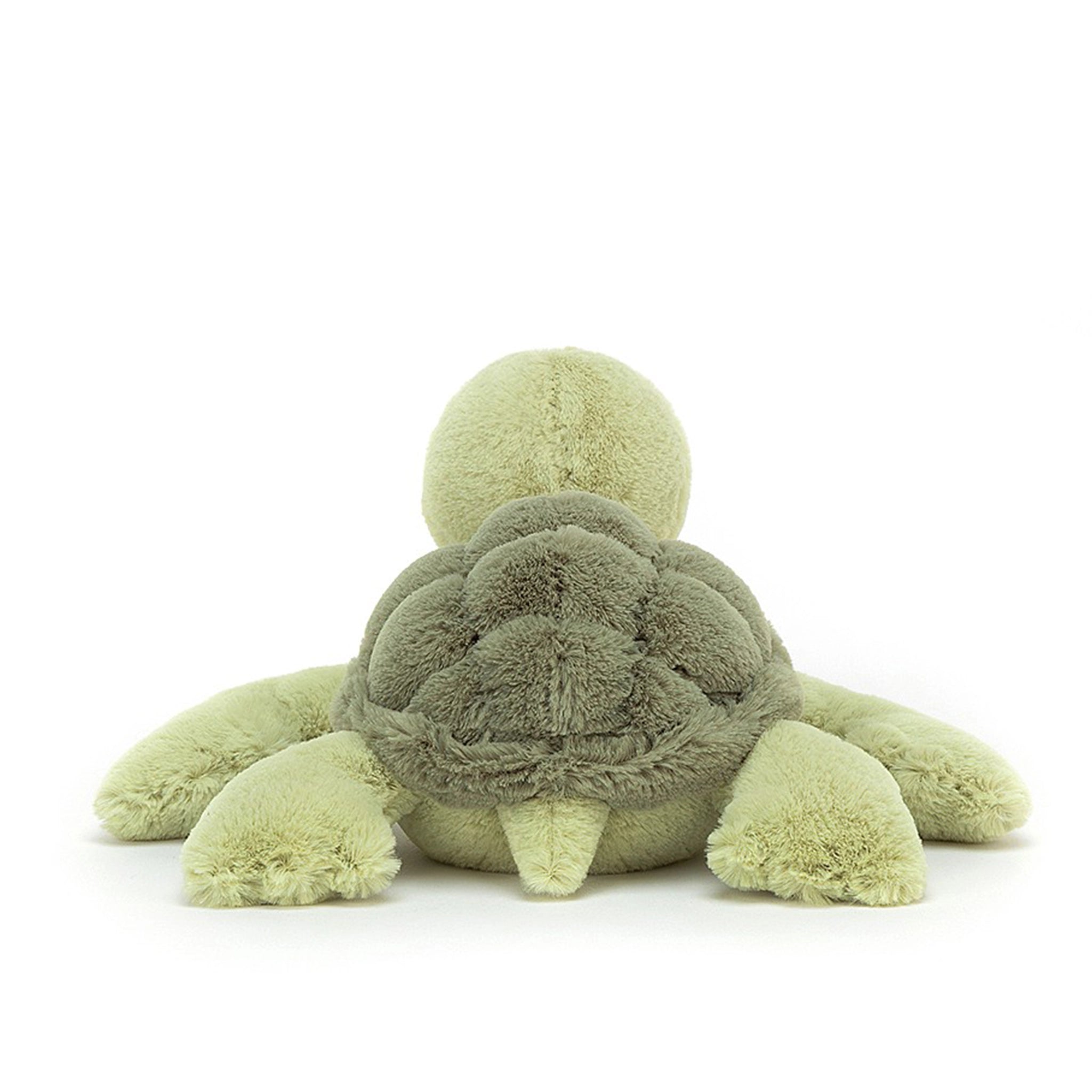 On a white background is a light green turtle stuffed animal.