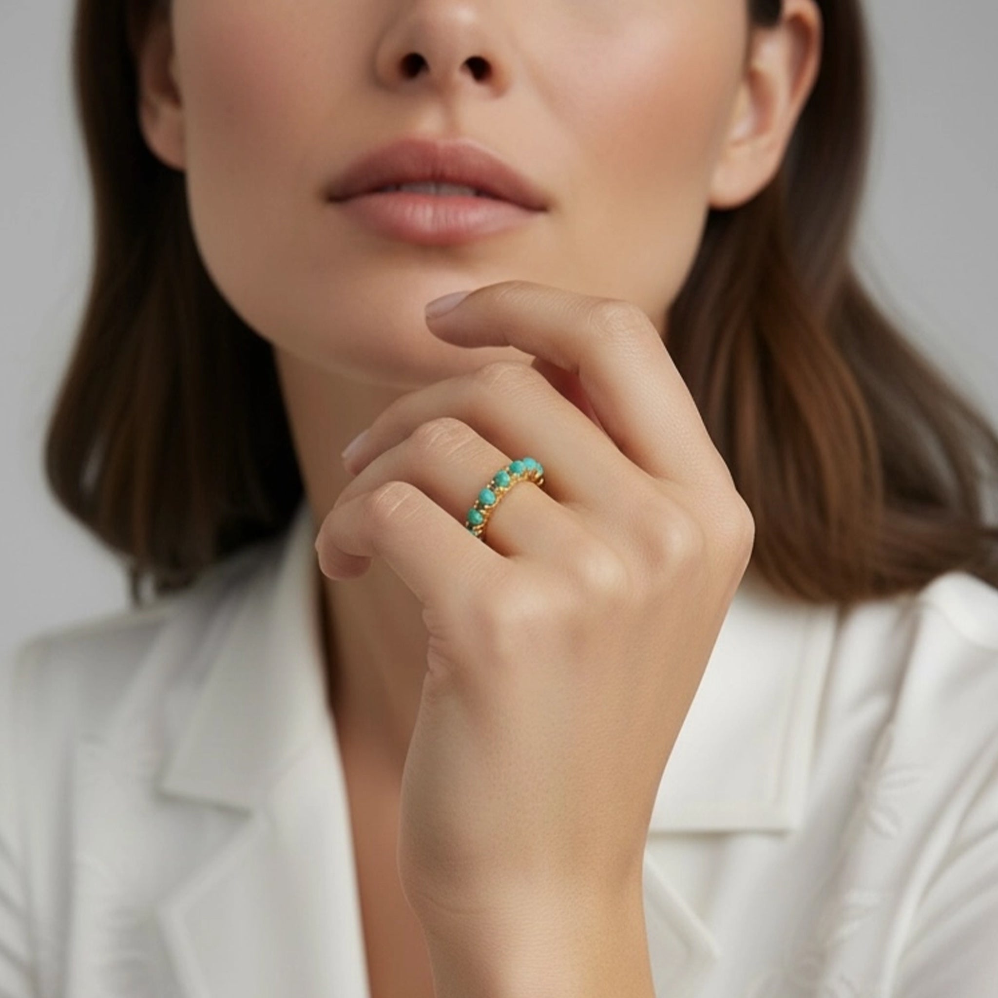  A gold crown style ring band with small turquoise stones along the top